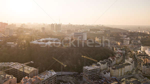 Artistic Kiev School and Construction workers at work are at the top of the building on Vozdvizhenka Stock photo © artjazz