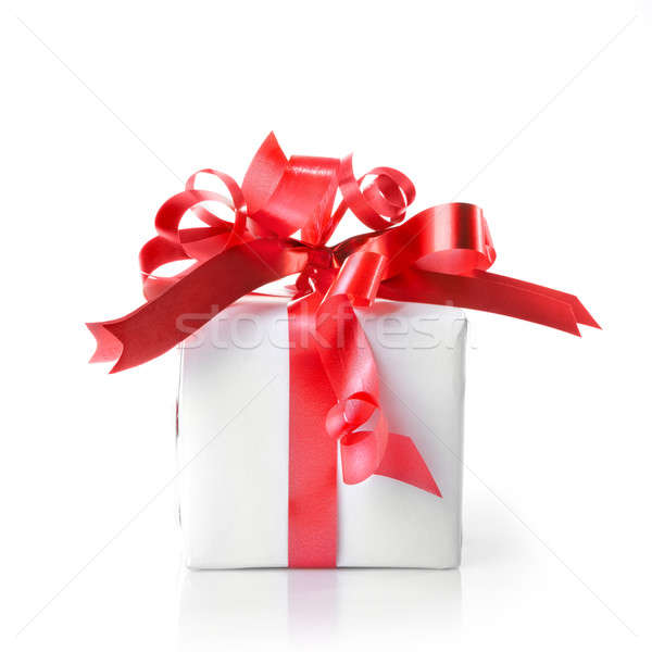 Holiday gift with red ribbon isolated on white Stock photo © artjazz