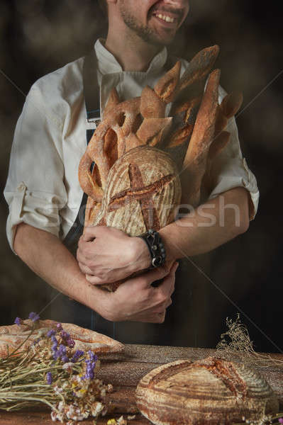 Baker keeps a variety of bread Stock photo © artjazz