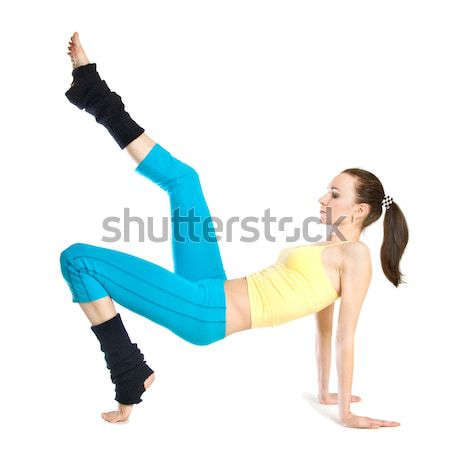 Piękna dziewczyna gimnastyka biały kobieta ciało wykonywania Zdjęcia stock © artjazz