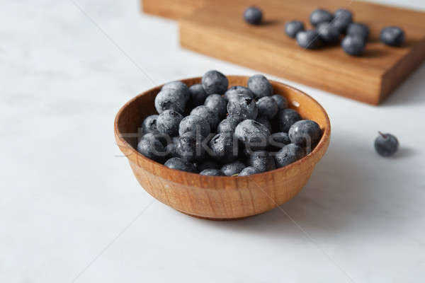 Stock photo: Natural freshly picked blueberries for cooking sweet desserts on kitchen table.
