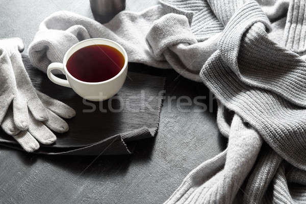 Stock photo: Cup of hot coffee on a black table