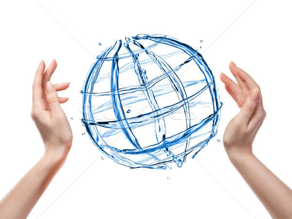 Globe from water with human hand isolated on white Stock photo © artjazz