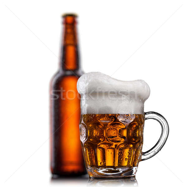 Beer in glass with water drops isolated on white  Stock photo © artjazz