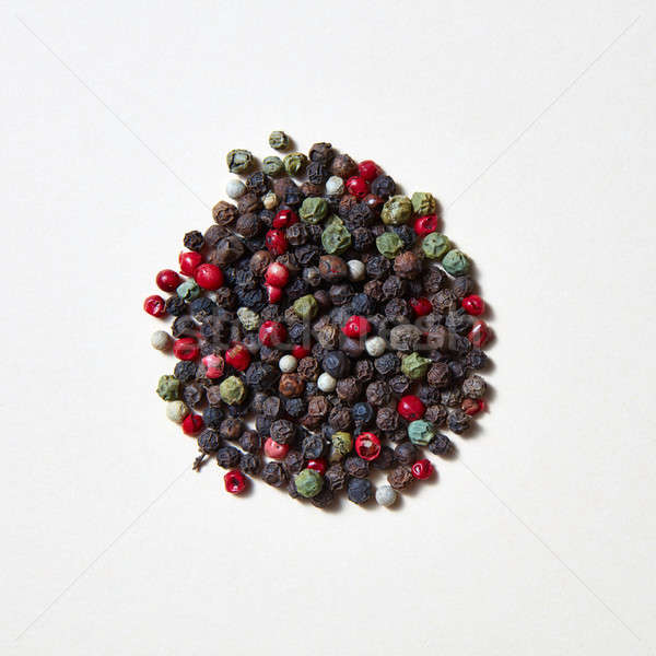 Flavouring pattern of different kinds of pepper -black, green, red, white isolated on a white backgr Stock photo © artjazz