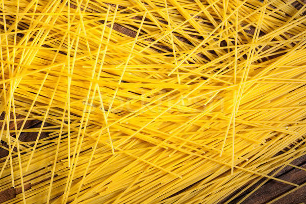 italian spaghetti on wooden background Stock photo © artjazz