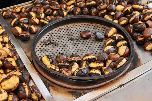 Grilled chestnuts for sale on street Stock photo © artjazz