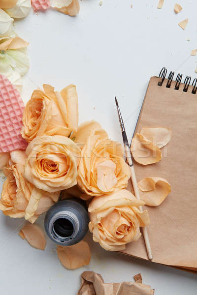 Roses and heart with notebook Stock photo © artjazz