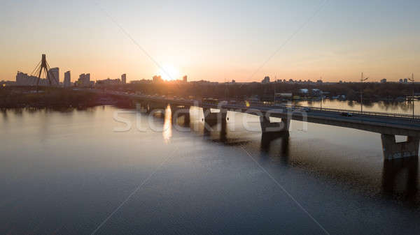 Sunset of north bridge over the Dnieper River, Kiev. Stock photo © artjazz