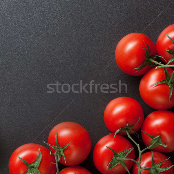 red tomatoes on blac Stock photo © artjazz