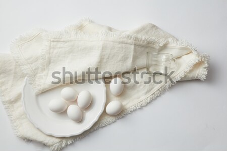 Nyers tojások fehér tányér tyúk ruha Stock fotó © artjazz