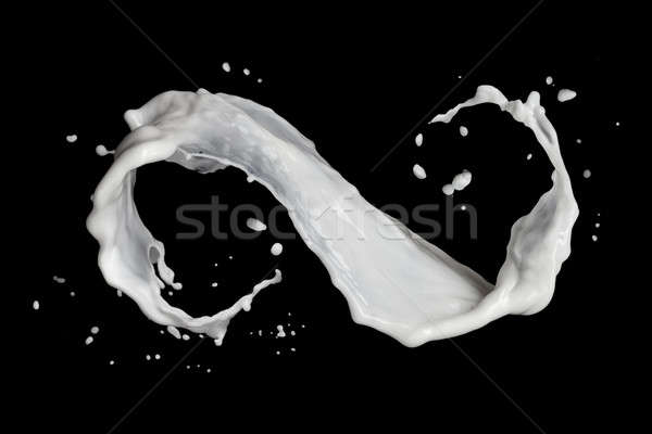 Simbolo di infinito latte splash isolato nero alimentare Foto d'archivio © artjazz