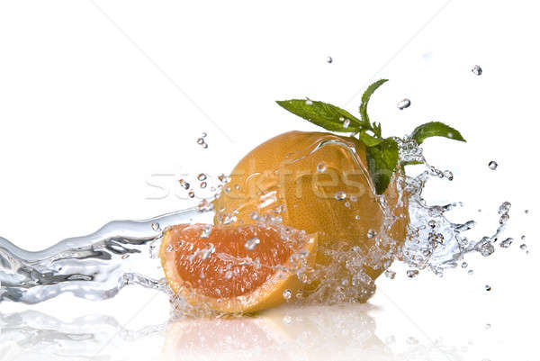 Water splash on orange with mint isolated on white Stock photo © artjazz