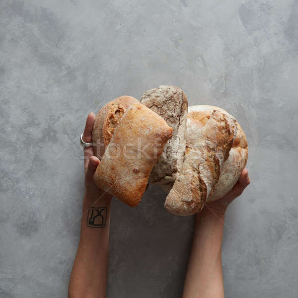 hand holding tasty fresh bread, Stock photo © artjazz