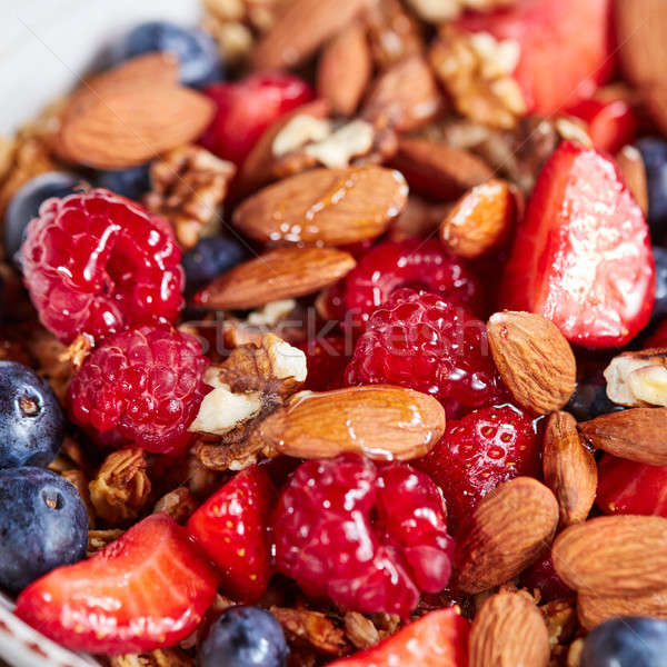 Natural organic raspberry, strawberry, blueberry, nuts, oat flax Stock photo © artjazz