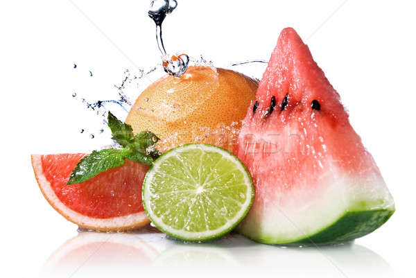 Stock photo: Water splash on  fresh fruits isolated on white