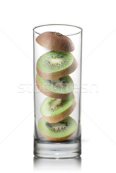 falling kiwi slices inside glass isolated Stock photo © artjazz