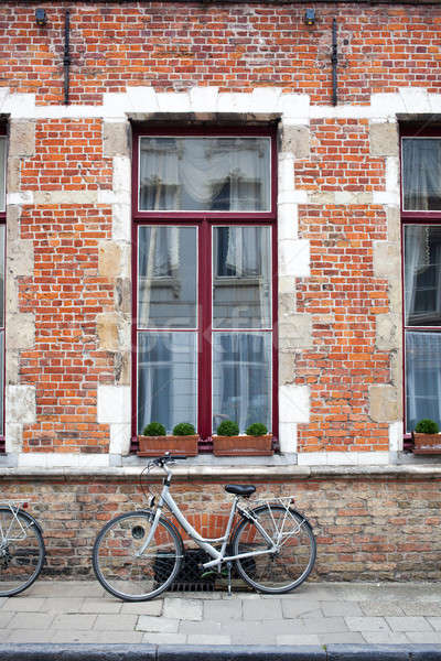 Stock photo: Vintage bicycle in front of old brick wall