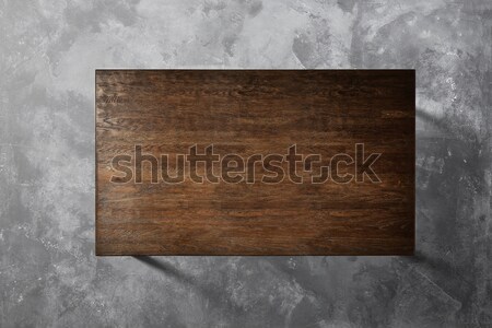 Wooden table on a concrete background Stock photo © artjazz