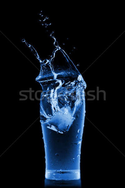 water splash in glass isolated on black Stock photo © artjazz