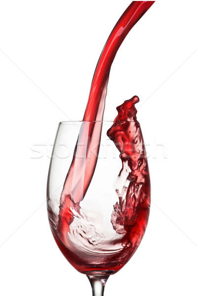 Stock photo: Splash of wine in glass isolated on white