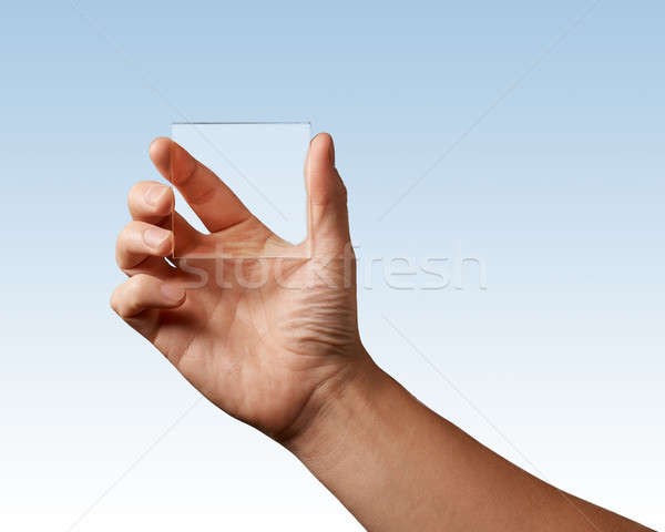 transparent glass represented in hand Stock photo © artjazz