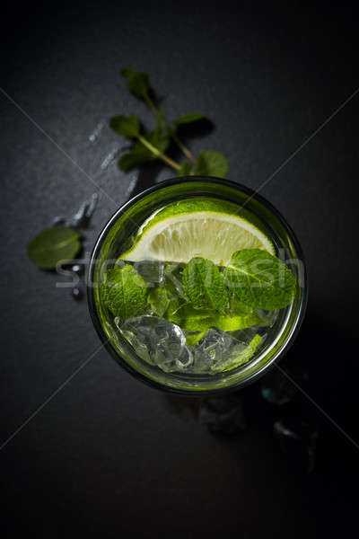 Lemonade or citrus cocktail with ice and mint overhead shot Stock photo © artjazz