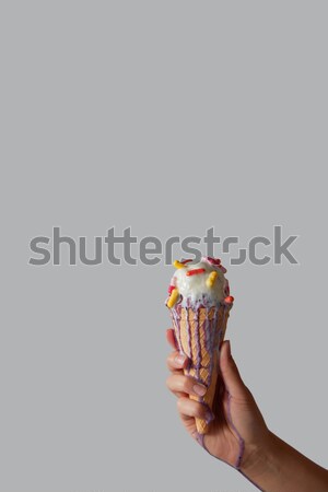 Waffle cone with melting ice cream and pills, holds female hand  Stock photo © artjazz