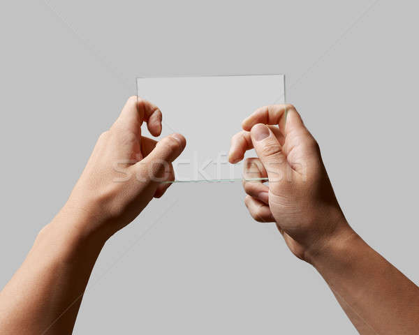 Przezroczysty szkła mężczyzna ręce prostokątny szary Zdjęcia stock © artjazz
