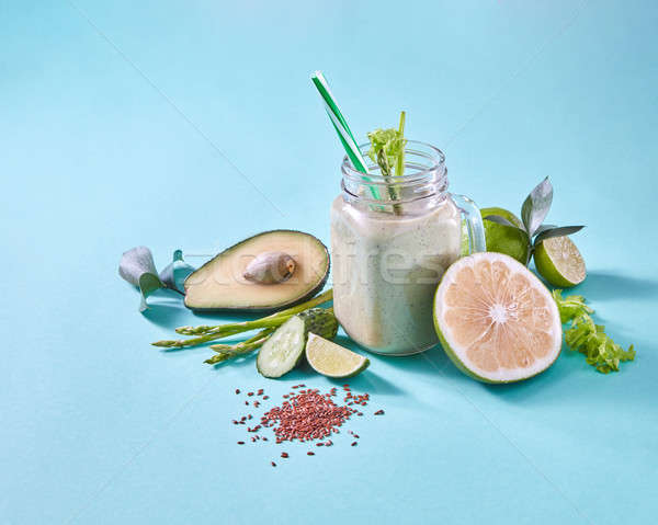 Natural ingredients for healthy smoothie from avocado with cucumber, celery, shpinach, lemon, flax s Stock photo © artjazz