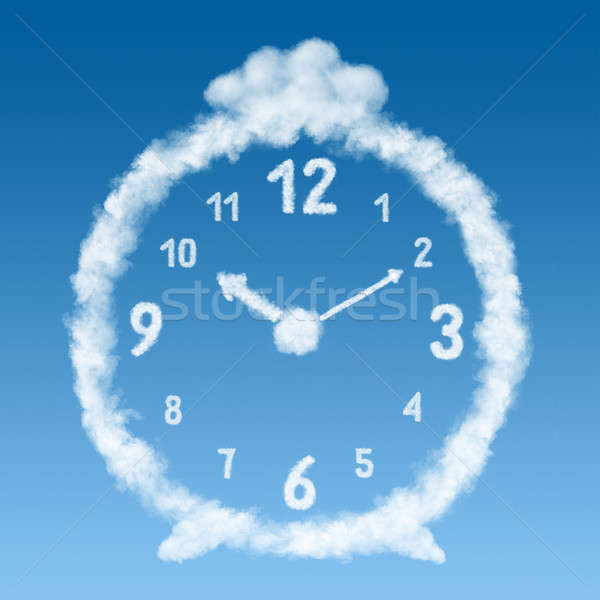 the alarm clock made of clouds in blue sky Stock photo © artjazz