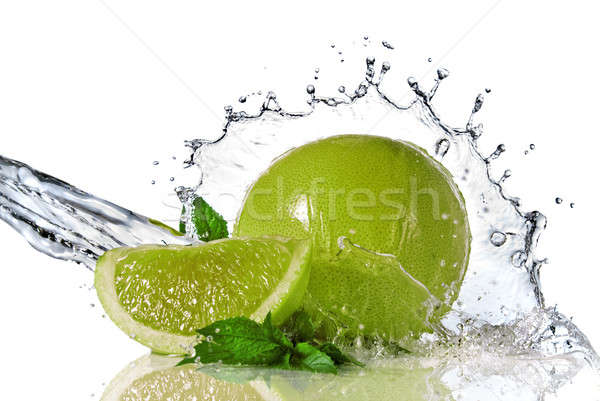 Water splash on lime with mint isolated on white Stock photo © artjazz
