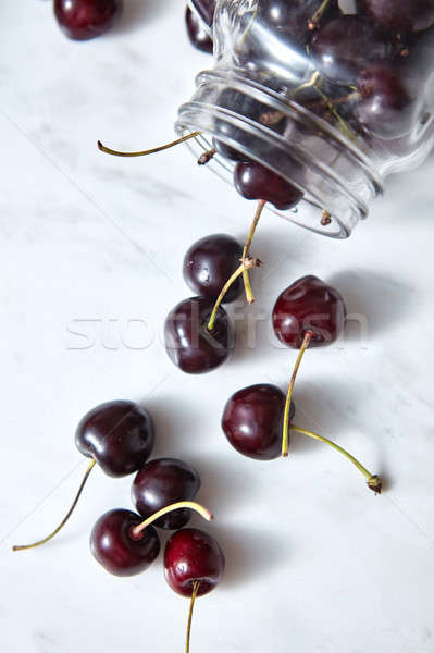 Fresh natural organic cherries on white background for making delicious natural jam. Top view. Stock photo © artjazz