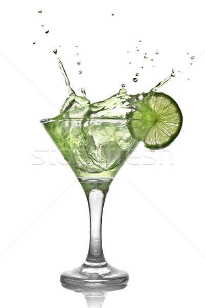 Green alcohol cocktail with splash and green lime isolated on white Stock photo © artjazz