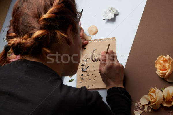Hand with brush writing a love letter Stock photo © artjazz