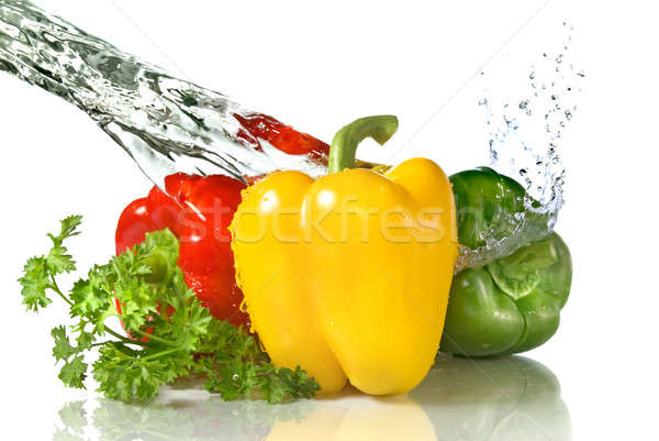  red, yellow, green pepper and parsley with water splash isolated on white Stock photo © artjazz
