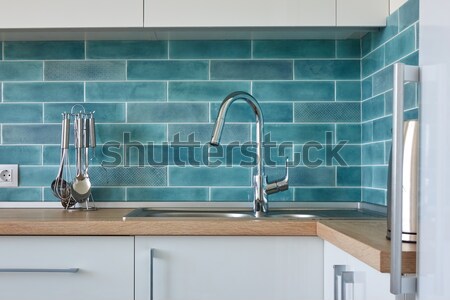 View of the kitchen brown countertop with white hob Stock photo © artjazz