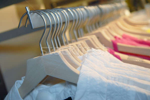 clothes on racks in store Stock photo © artjazz