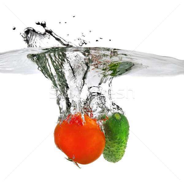 tomato and cucumber dropped into water isolated on white Stock photo © artjazz