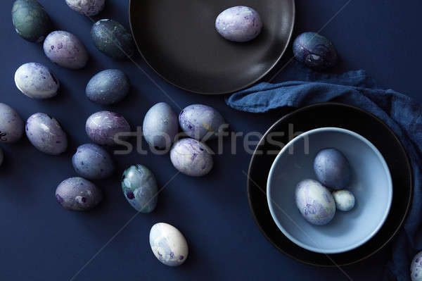 Színes tojások tányér szalvéta sötét kék tavasz Stock fotó © artjazz