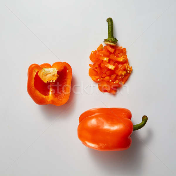 Opened , whole yellow bell pepper and slices on gray background Stock photo © artjazz