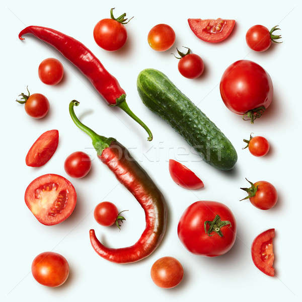 Red chili pepper, cucumber and tomato on white Stock photo © artjazz