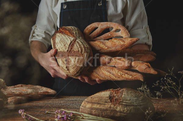 Variety of bread hold men's hands Stock photo © artjazz