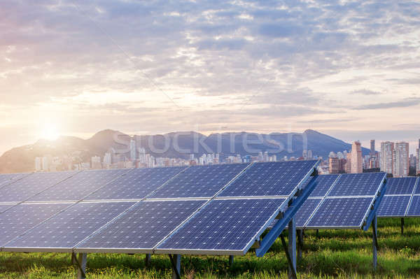 Solar panels with city on background Stock photo © artjazz