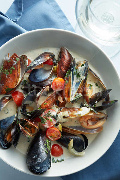 Steamed mussels in white wine sauce Stock photo © artjazz