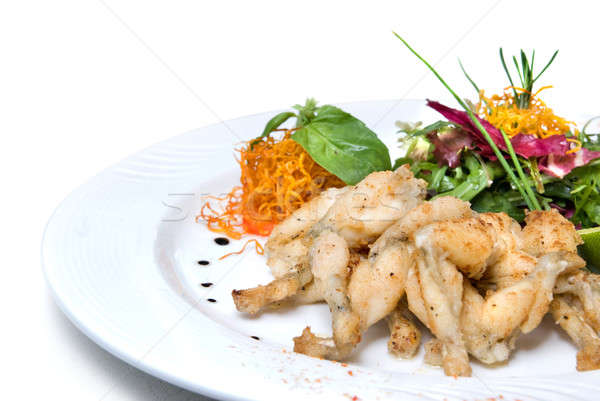 fried frogs legs on the plate isolated on white Stock photo © artjazz