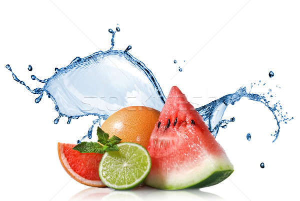 Watermelon, grapefruit and lime with mint and water splash isola Stock photo © artjazz