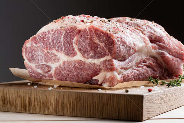 Photo of raw meat. Pork neck with herbs Stock photo © artjazz