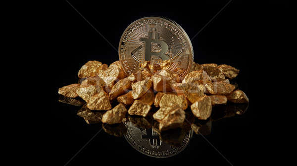 Bitcoin coin cryptocurrency and mound of gold nuggets on a black reflective background Stock photo © artjazz