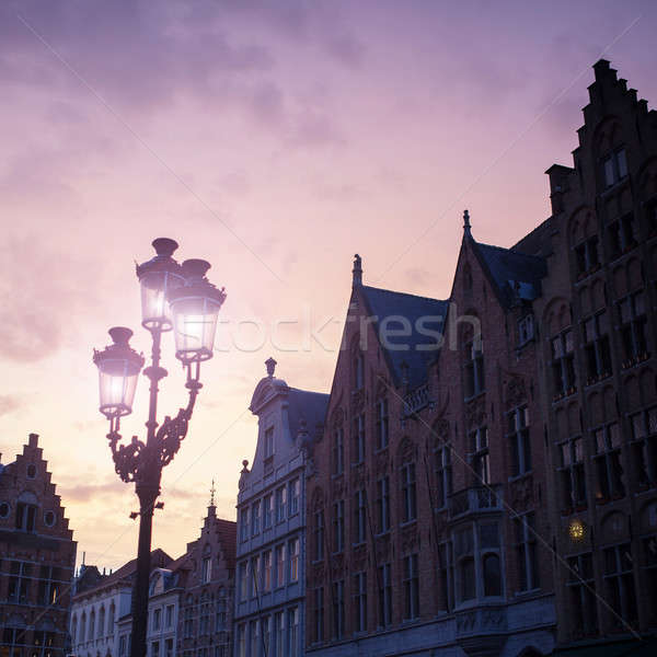 Silhouettes of city center houses in Bruges against beautiful su Stock photo © artjazz